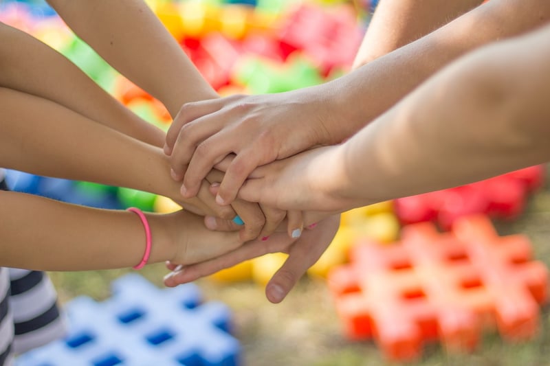 Friends and family holding hands